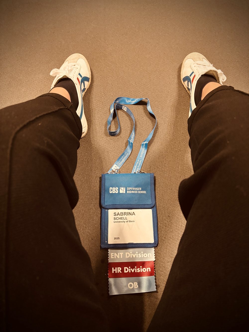 Sabrina Schell with an Academy of Management conference badge